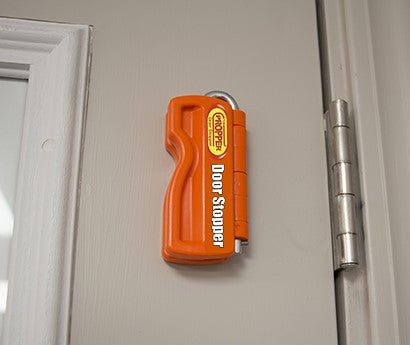 Propper door stopper holding a door open securely